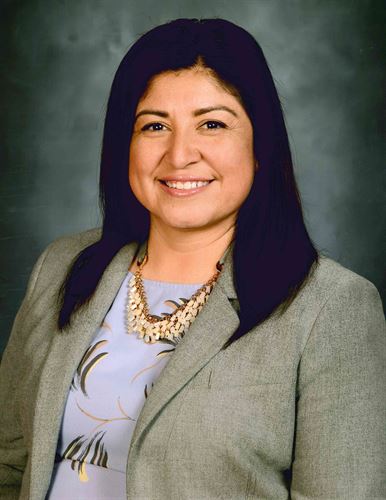 A portrait of a smiling woman